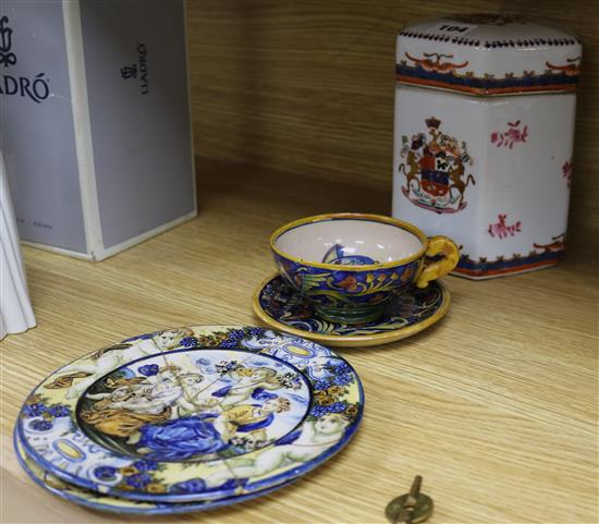 A Cantagalli cup and saucer, two plates and an armorial lidded decanter